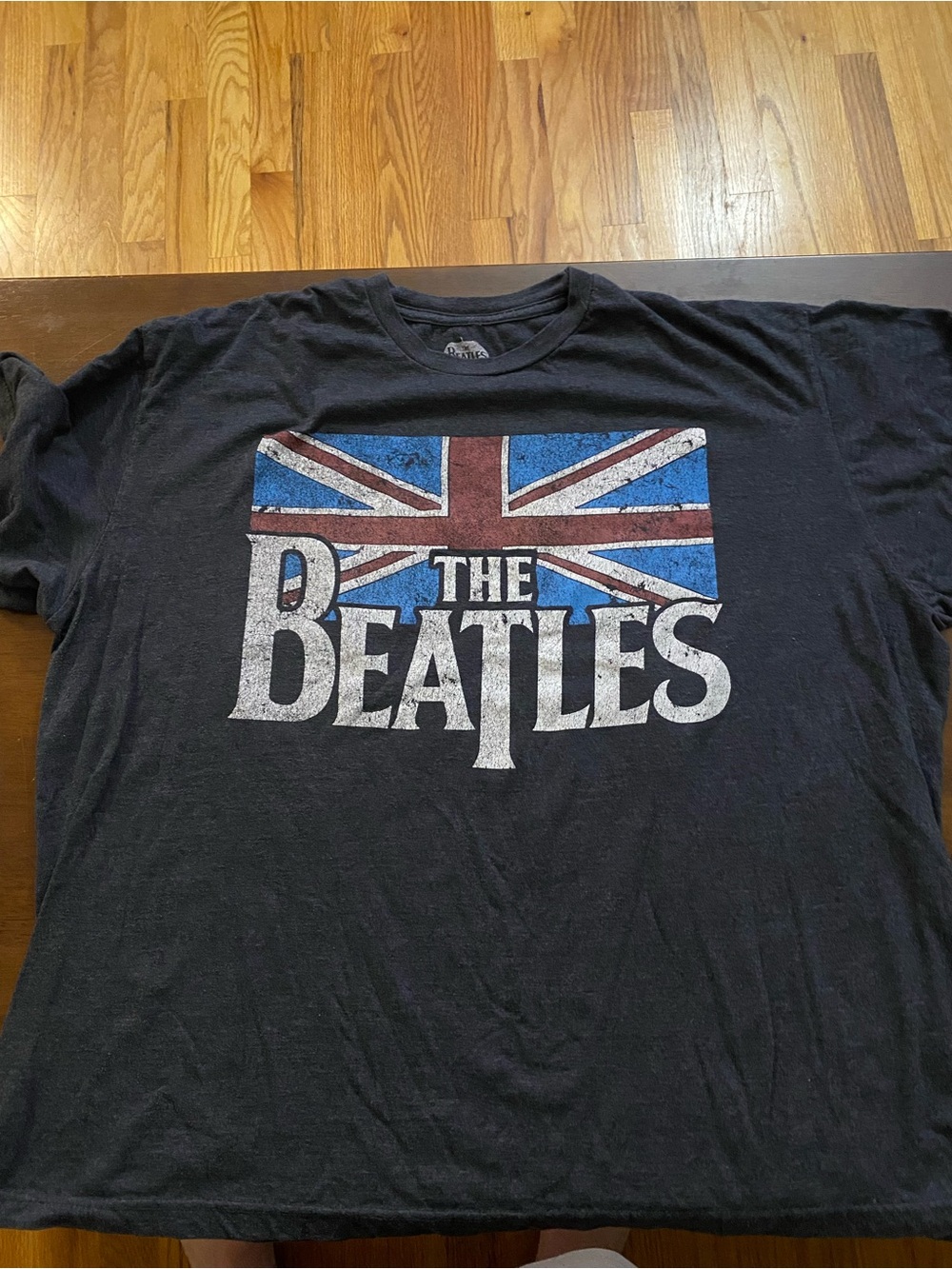 The Beatles Black T‑Shirt with Red, Blue and White Union Jack Graphic